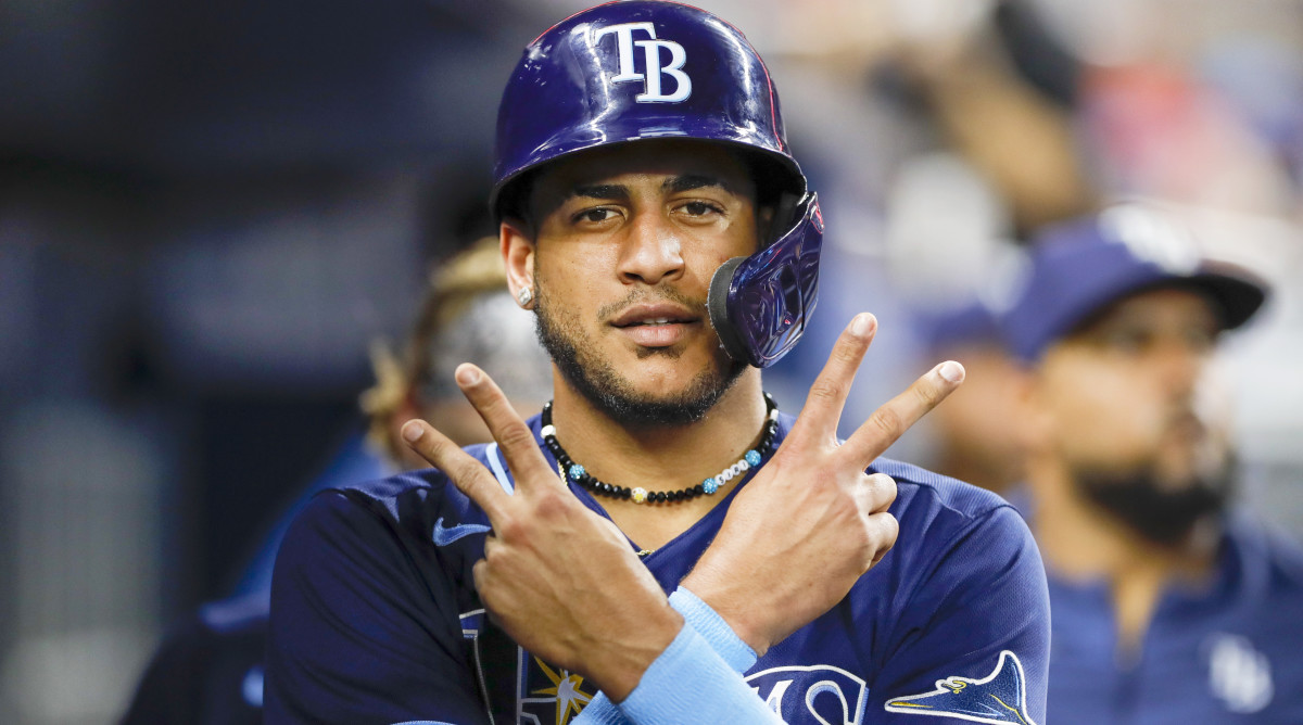 Aug 30, 2022; Miami, Florida, USA; Tampa Bay Rays center fielder Jose Siri (22) gestures in the dugout after scoring a run during the third inning against the Miami Marlins at loanDepot Park.